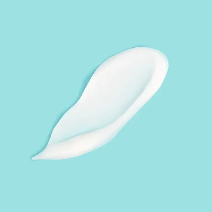 White feather on a light blue background