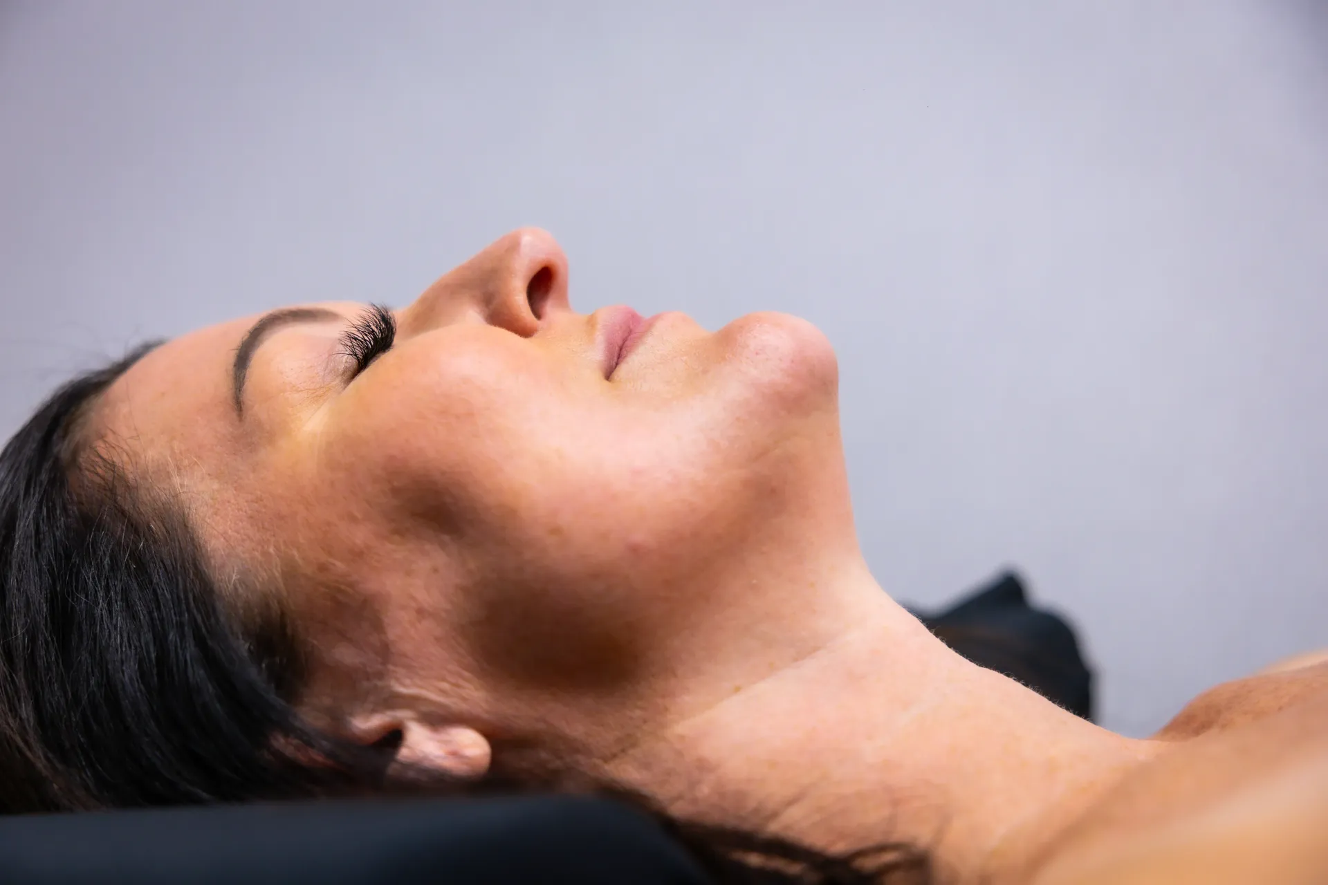 Woman receiving dermal filler facial balancing treatment at RAW MedSpa in Olivia MN