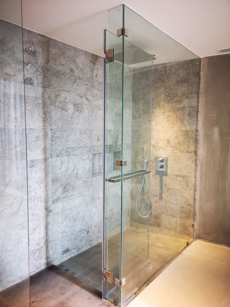 A Bathroom With a Walk in Shower With a Glass Door — Headlands Glass in Ballina, NSW