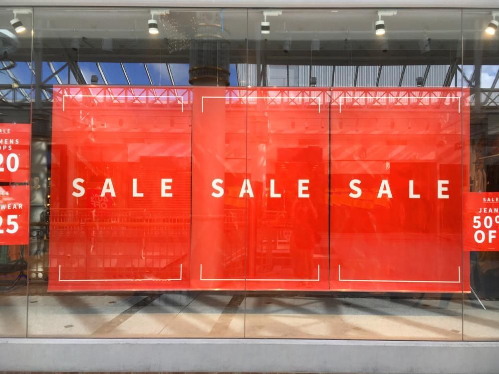 A Store Window With a Red Sign — Headlands Glass in Ballina, NSW