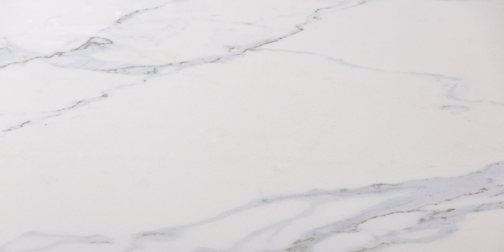 A close up of a white marble counter top.