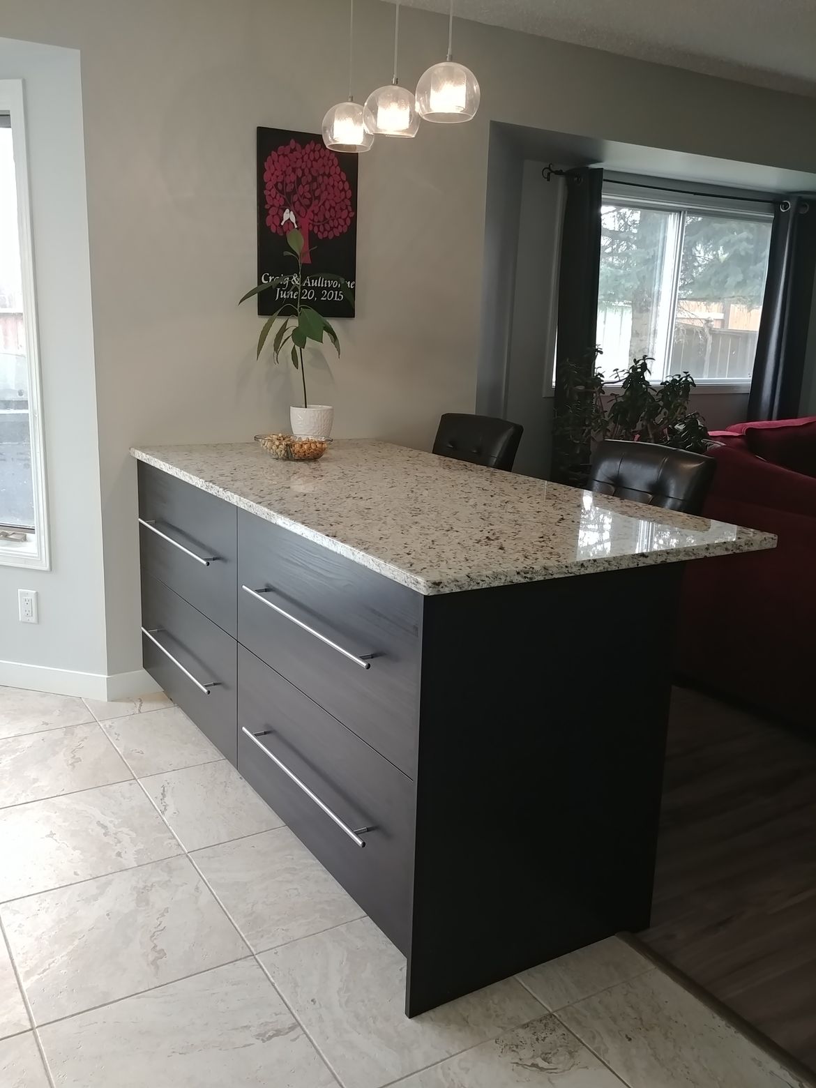 A kitchen with a large island in the middle of the room.