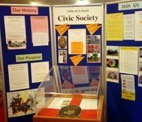 A display of information about the civic society is on a wall.
