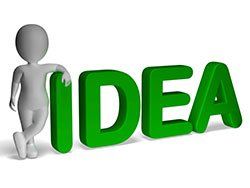 A 3d man is standing next to the word idea in green letters in Columbus