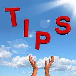 A pair of hands reaching up towards a blue sky with the words tips flying in the air in Columbus
