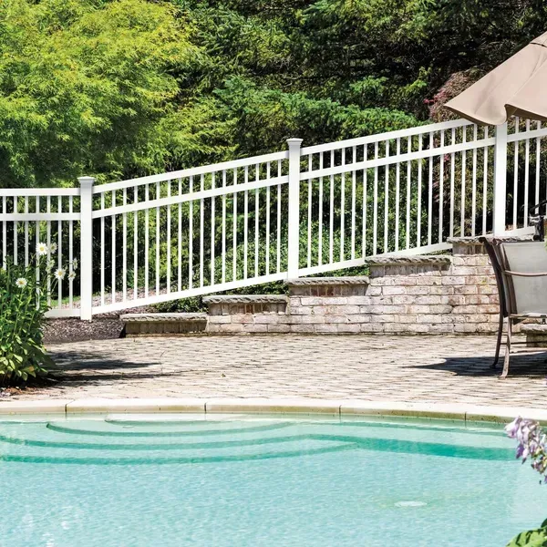 A swimming pool with a white aluminum fence surrounding it in Hillard