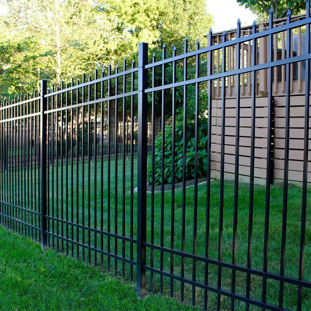 A black aluminum fence surrounds a lush green yard in Columbus