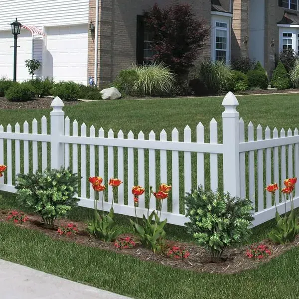 A white picket fence with flowers in front of a house in Upper Arlington