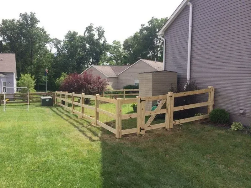 A wooden fence is in the backyard of a house in Columbus