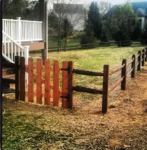 A wooden fence with a white railing in the background in Columbus