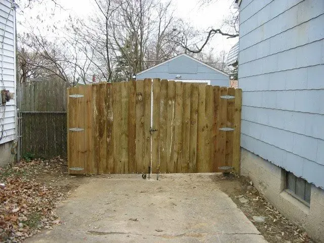 A wooden fence is in the backyard of a house in Columbus