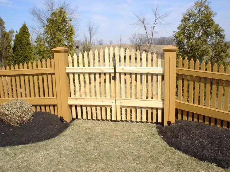 A wooden picket fence with a gate in the middle in Columbus