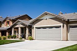 A row of houses with garage doors in a residential area in Columbus