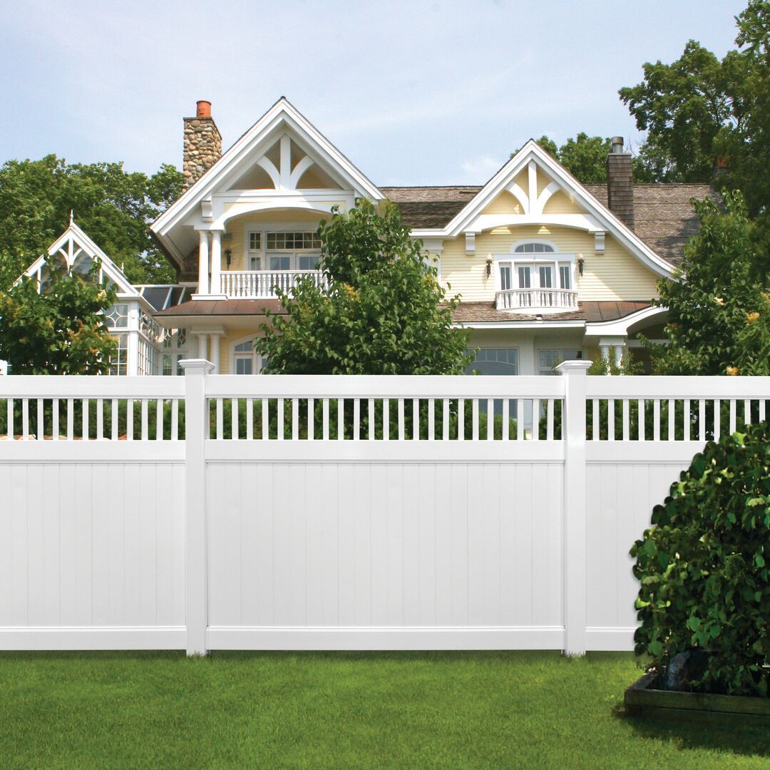 A house with a white fence in front of it in Powell