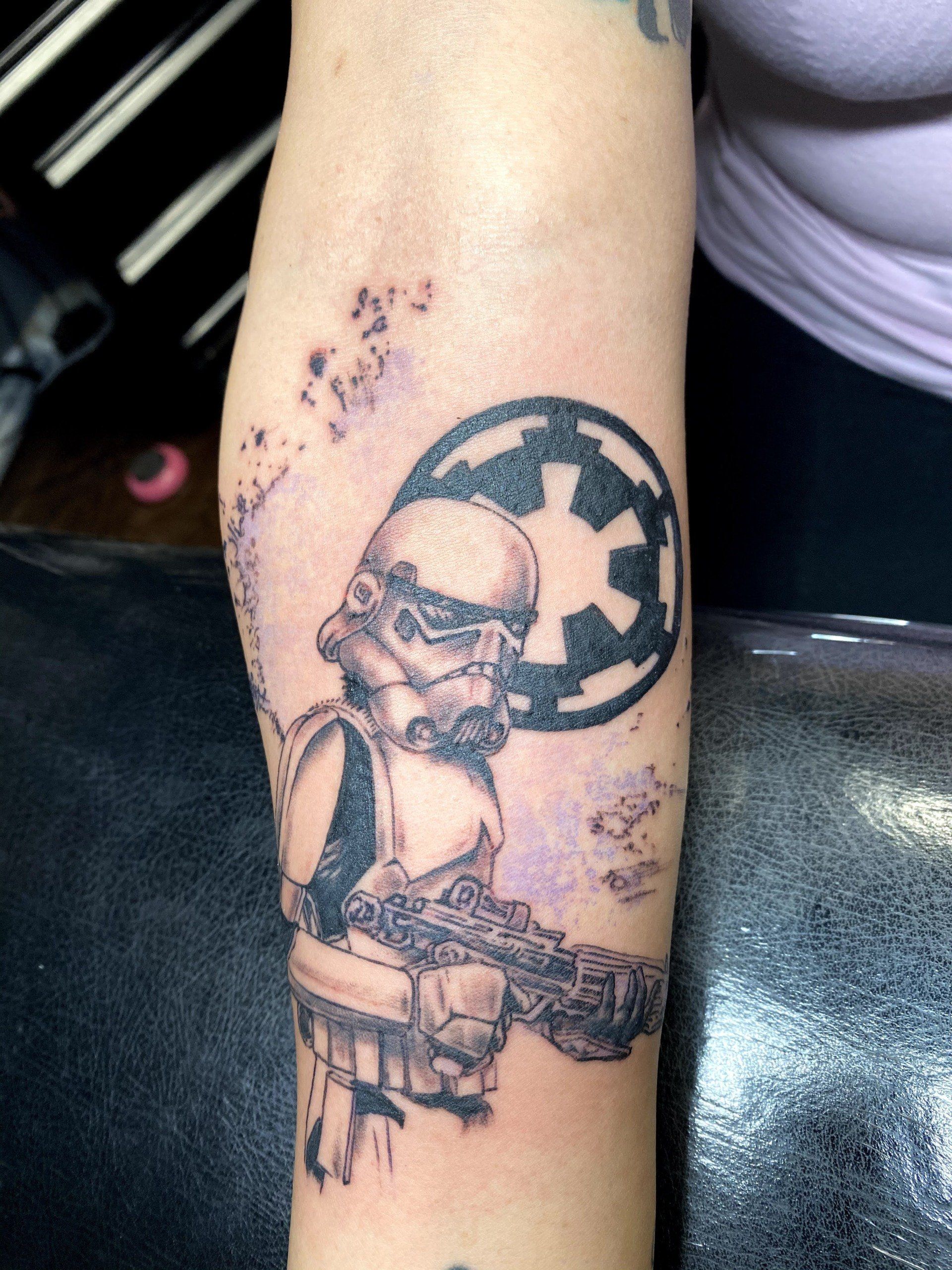 A woman has a storm trooper tattoo on her arm