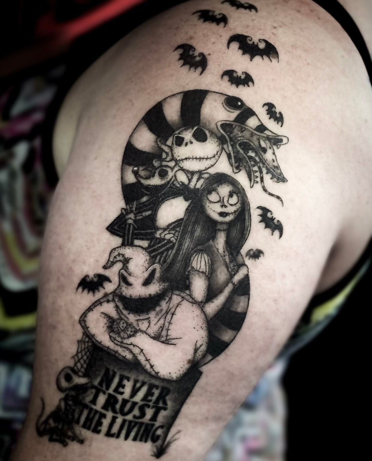 A nightmare before christmas tattoo on a person 's arm