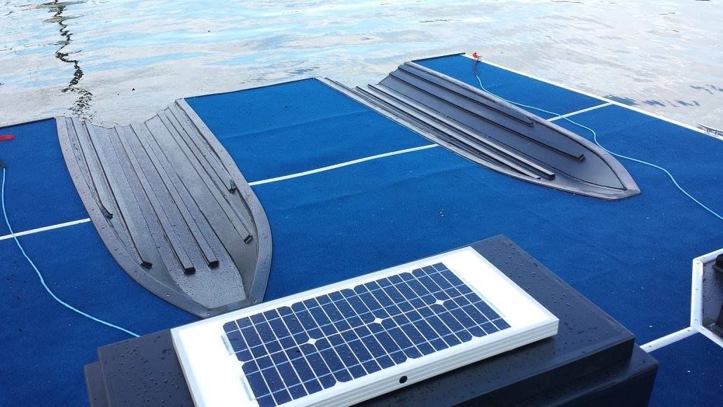 A Solar Panel is Sitting on Top of a Boat Dock — V.I.P. Plastic Fabrication in Portsmith, QLD