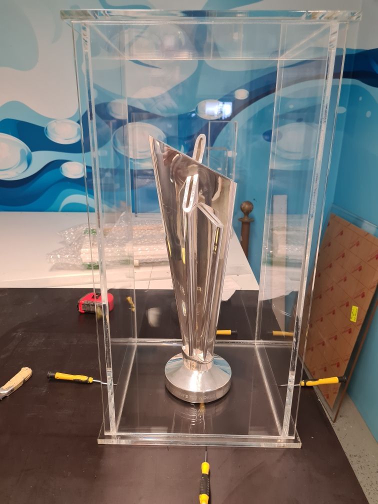 A Trophy is Sitting in a Clear Acrylic Case on a Table — V.I.P. Plastic Fabrication in Portsmith, QLD