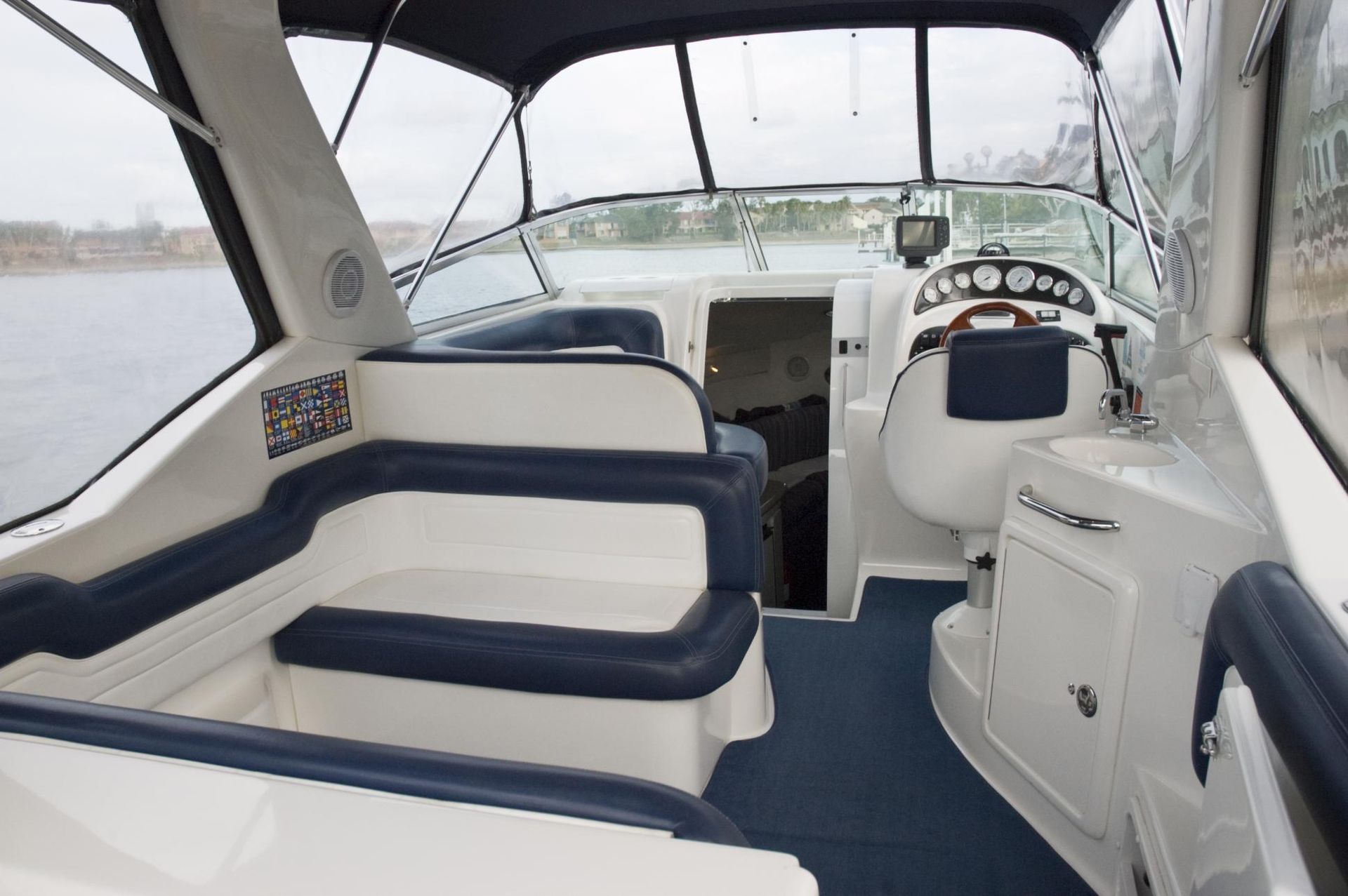 The Inside of a Boat With Blue Seats and a Steering Wheel — V.I.P. Plastic Fabrication in Portsmith, QLD