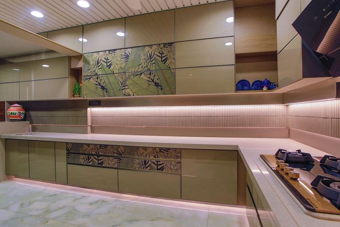 Large kitchen L-shaped counter with cabinets above and below. 