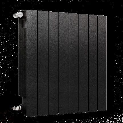 Radiador moderno de color negro con paneles verticales en ambiente oscuro.