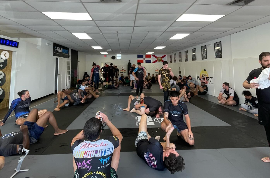 Adults training no-gi Jiu-Jitsu at 10th Planet Jiu-Jitsu Miami in Miramar, FL to build resilience and balance