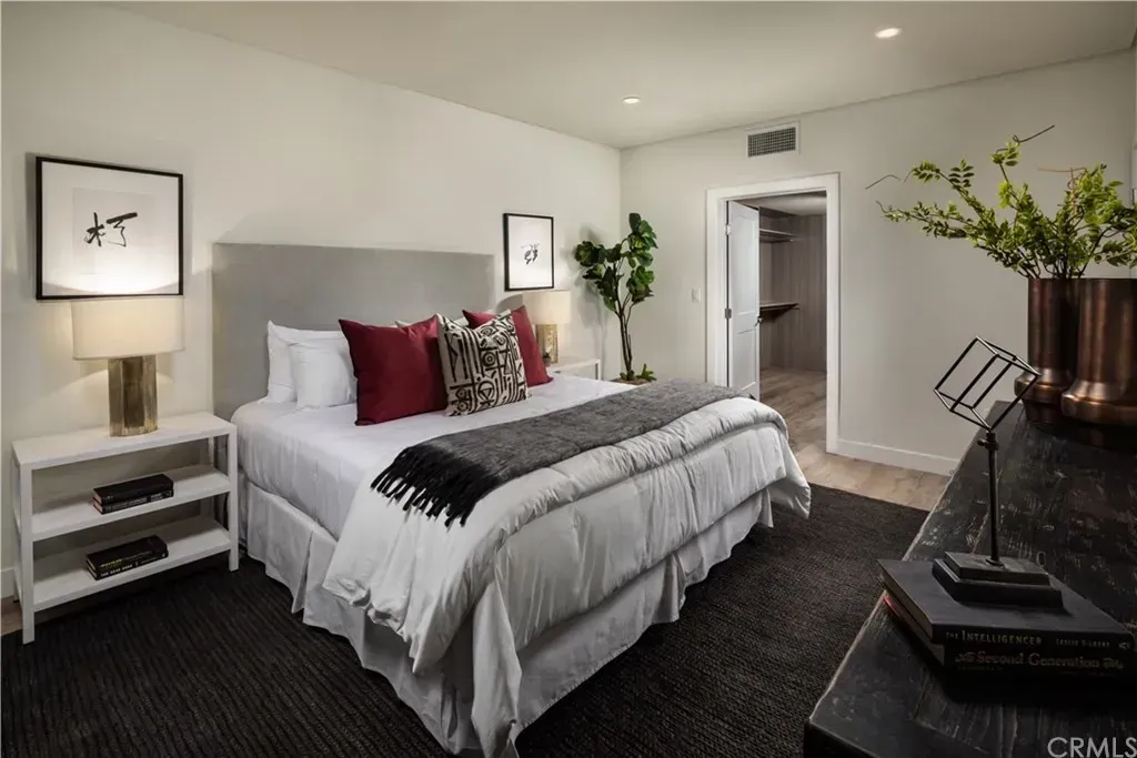 Modern apartment living room with large windows and natural light By Stoneridge Management Partners