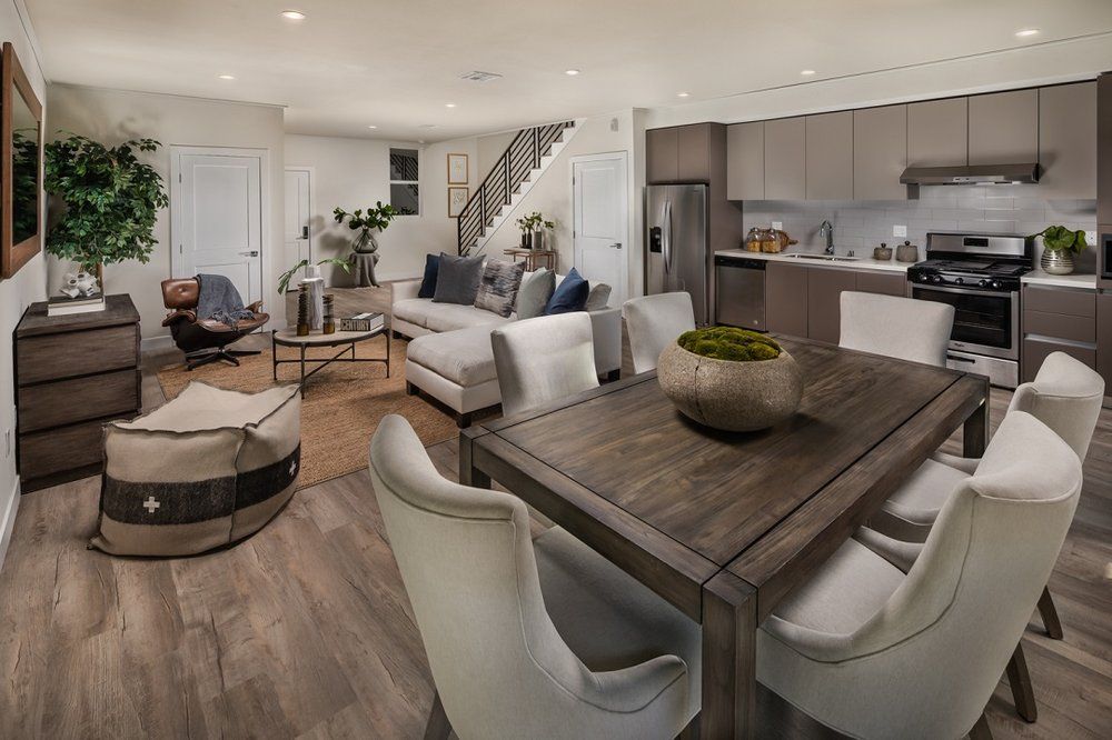 Modern apartment living room with large windows and natural light By Stoneridge Management Partners
