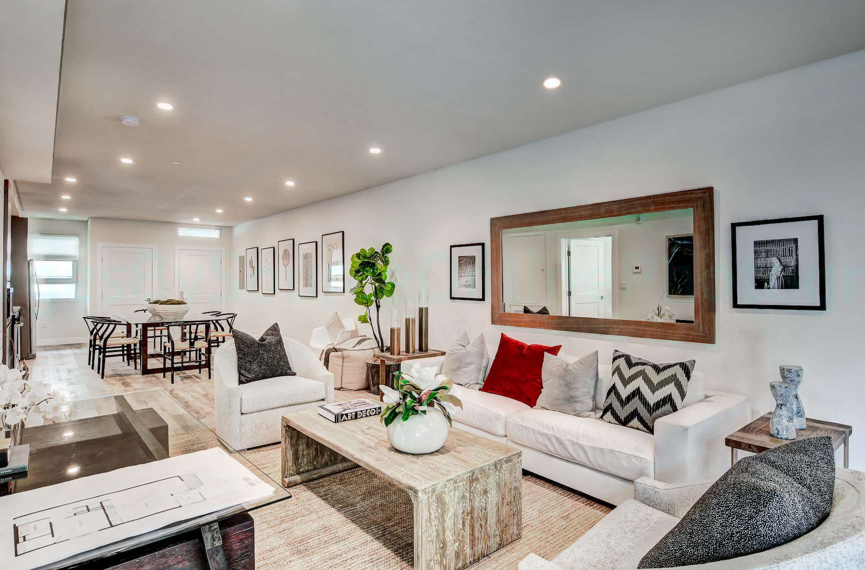Modern apartment living room with large windows and natural light By Stoneridge Management Partners