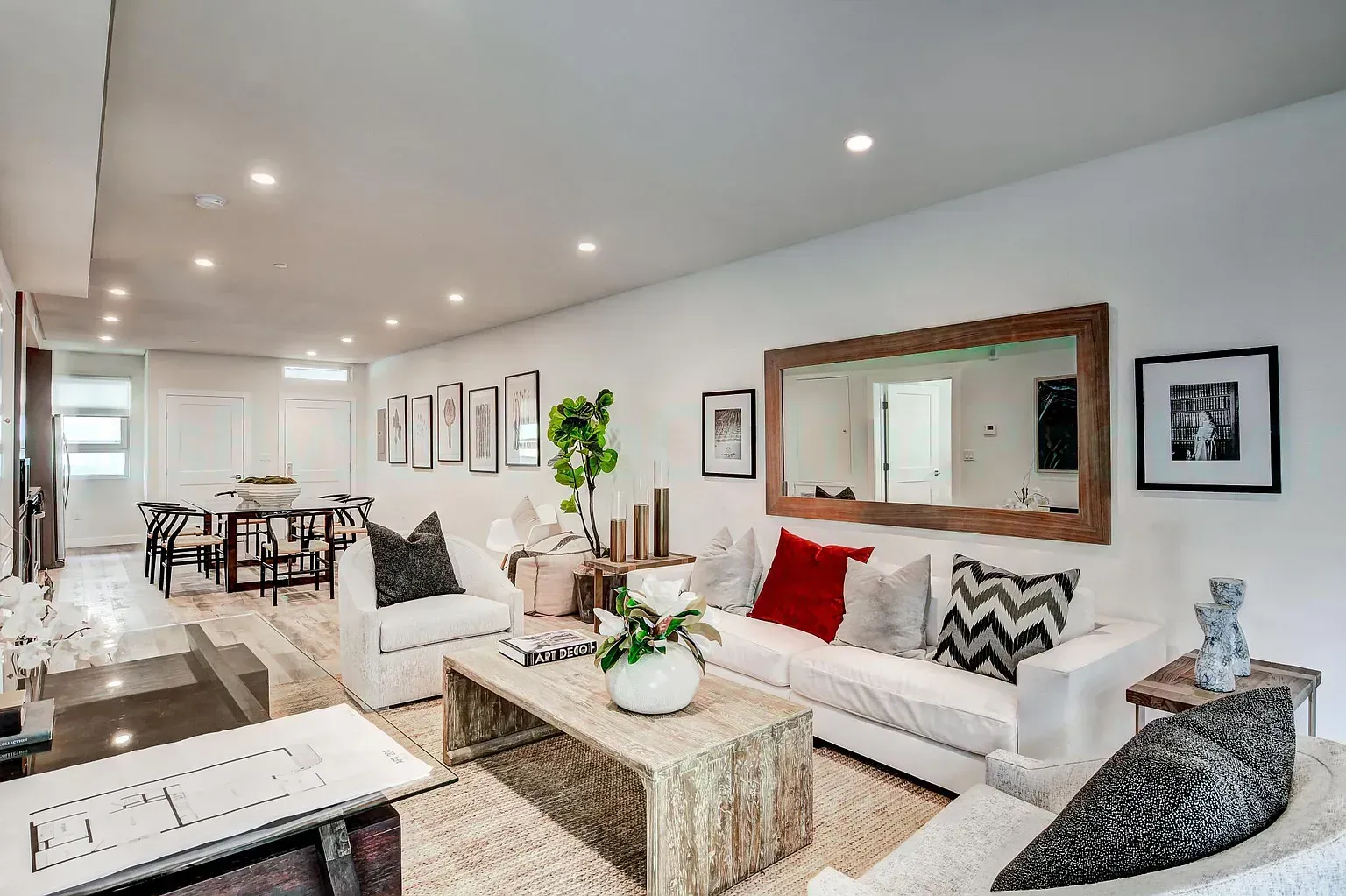 Modern apartment living room with large windows and natural light By Stoneridge Management Partners
