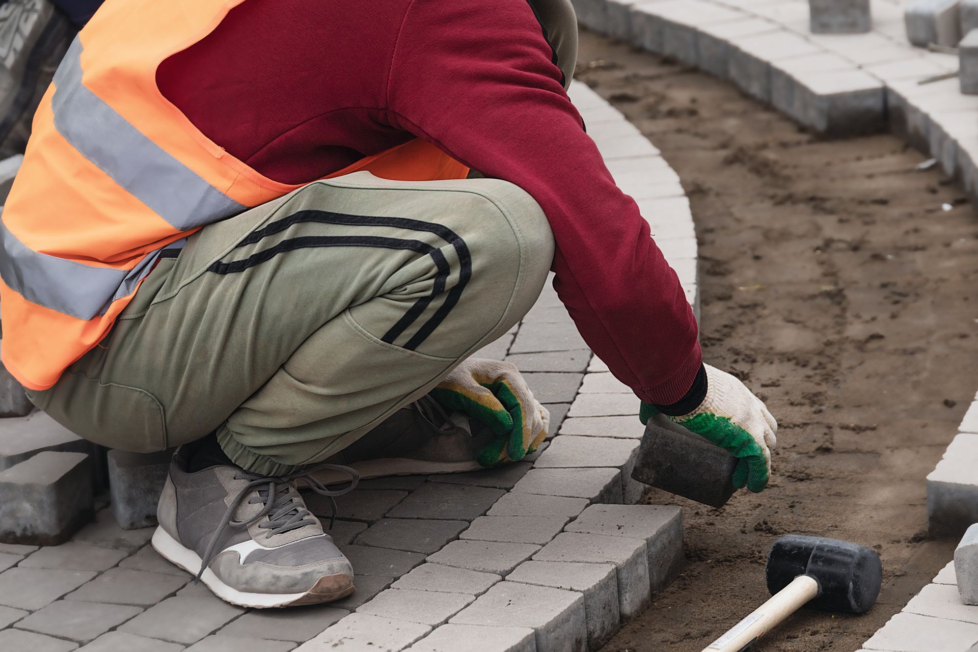 mason installing pavers