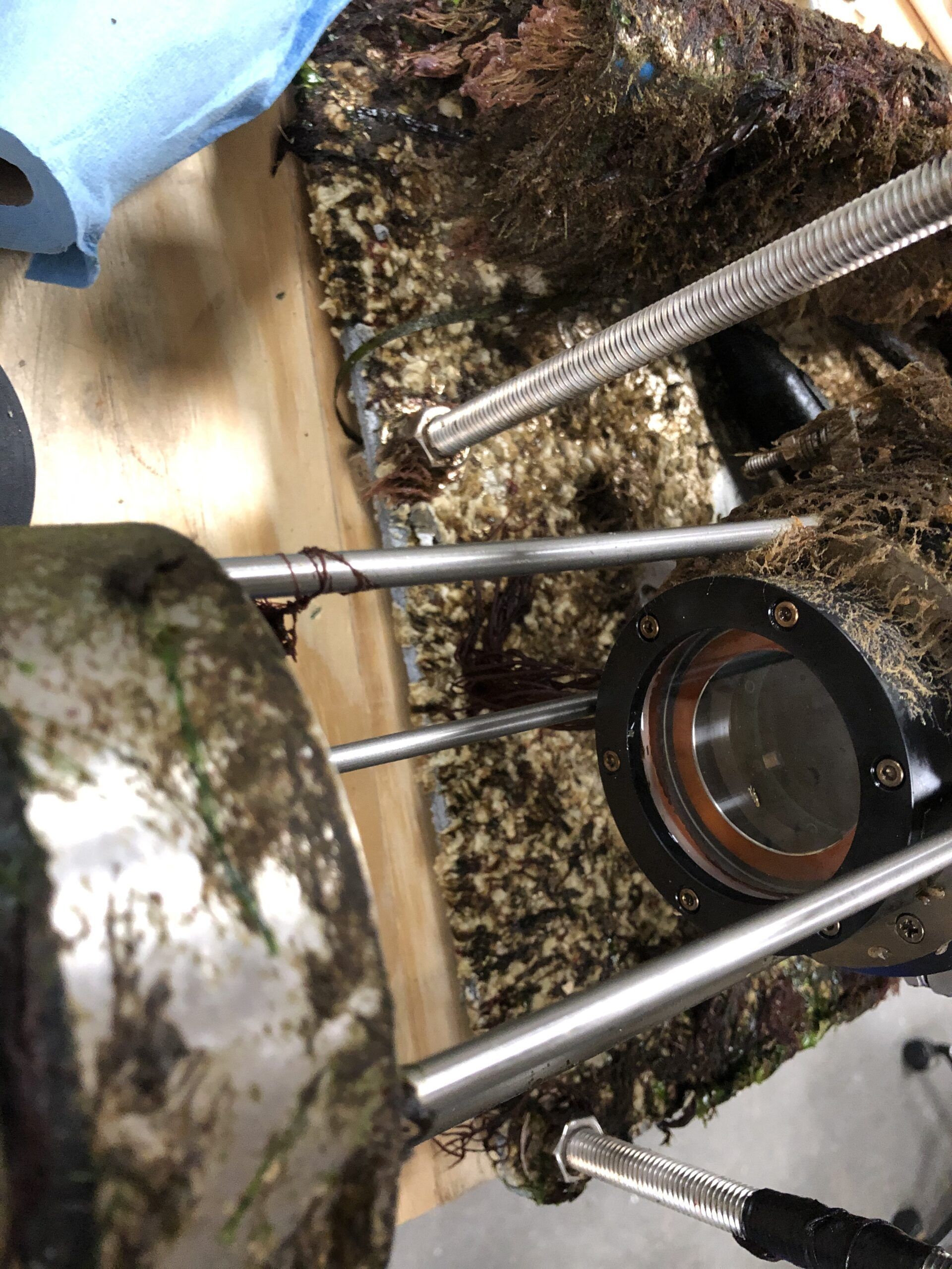 A close up of a metal object with a magnifying glass on top of it.