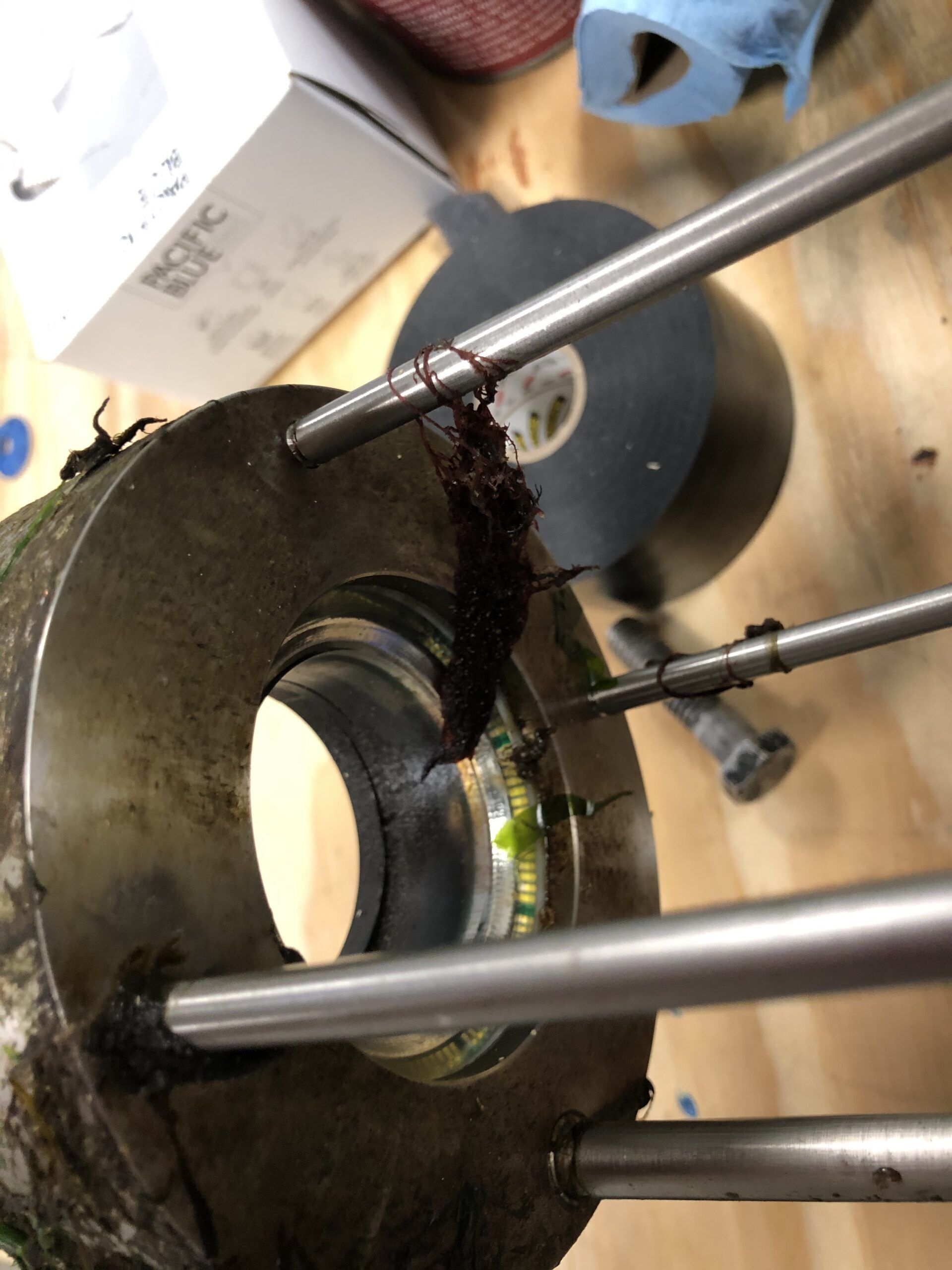 A close up of a metal object with a hole in it
