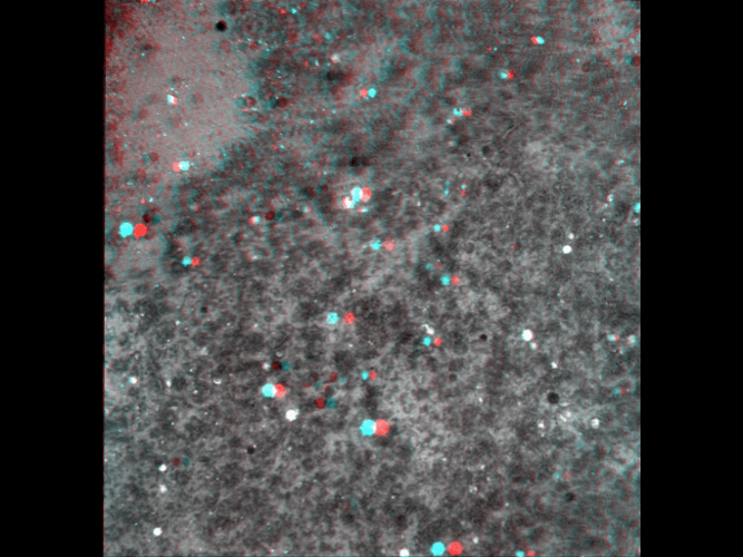 A 3d image of a gray surface with red , blue and white dots.