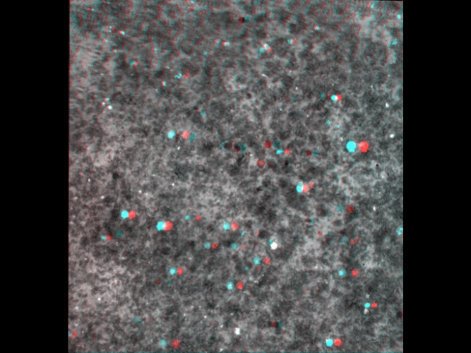 A 3d image of a gray surface with red and blue dots on it.