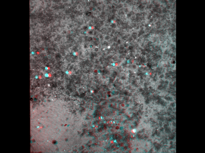A 3d image of a gray surface with red and blue dots on it.