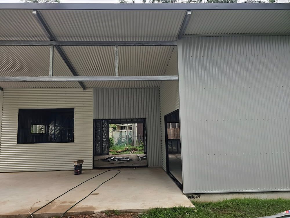 Exterior of a Building With Corrugated Metal Walls and Roof — KNG Roofing And Construction in Alice Springs, NT