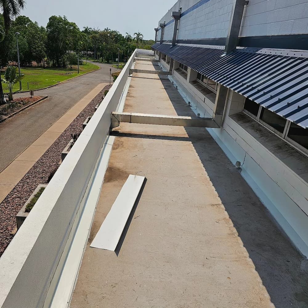 Exterior View of a Building Rooftop With White Trim — KNG Roofing And Construction in Maningrida, NT