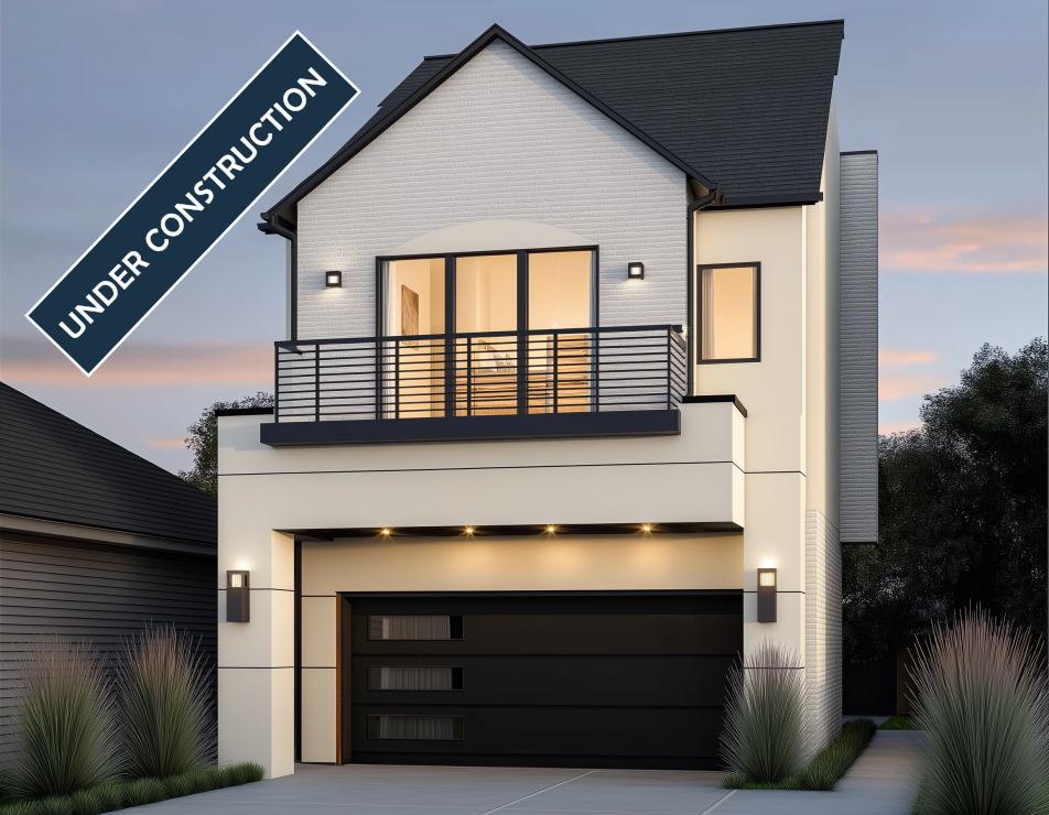 Modern two-story house under construction with black garage door and balcony. 