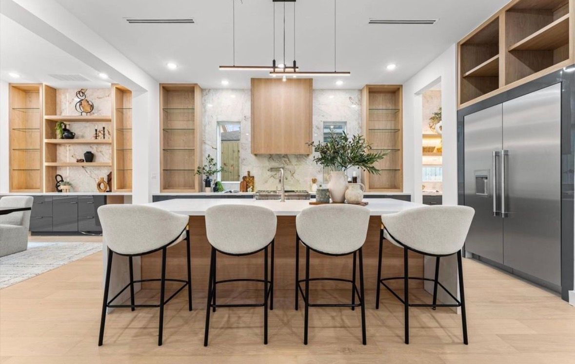 Large kitchen island with bar seating custom cabinetry and high end finishes