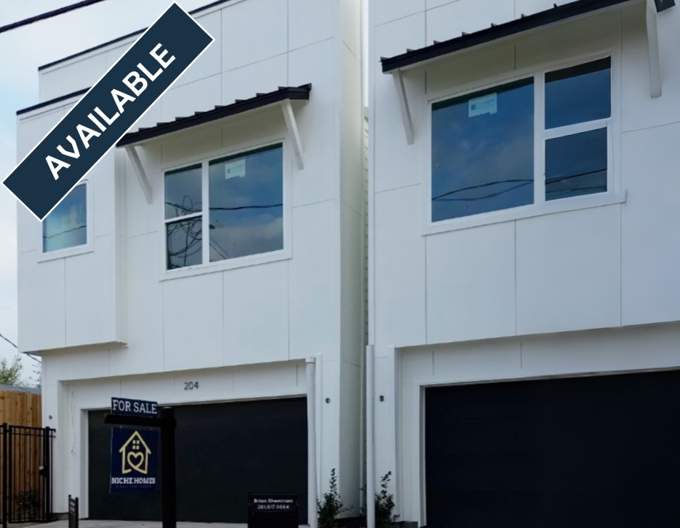 Two-story white houses with black garages,