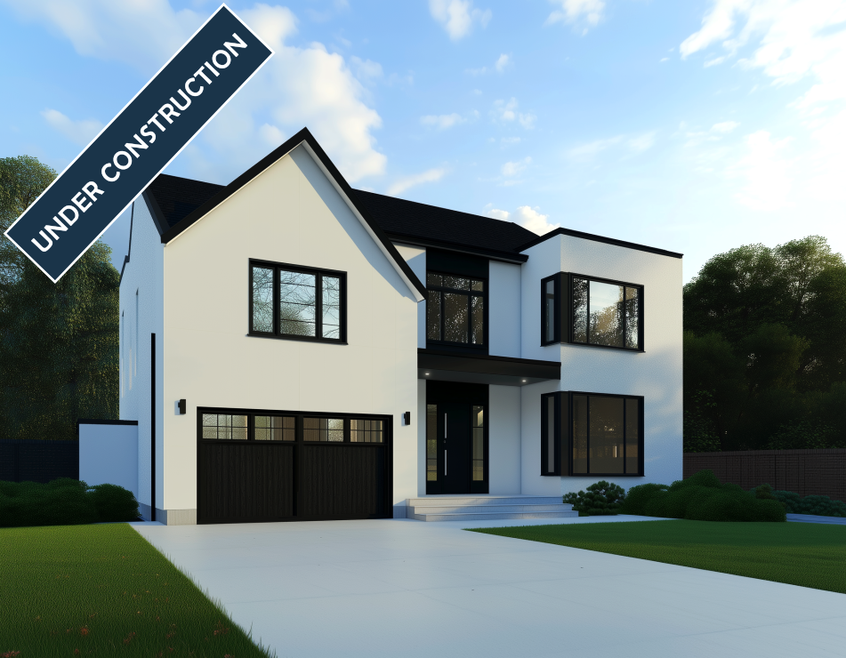 Modern white home under construction with black trim, windows, and garage door. Lush green lawn.