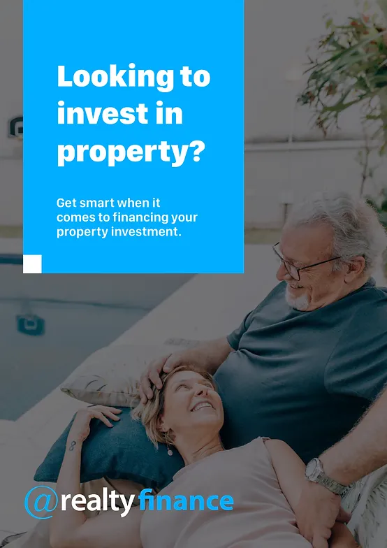 A man and woman are laying on a couch looking to invest in property.