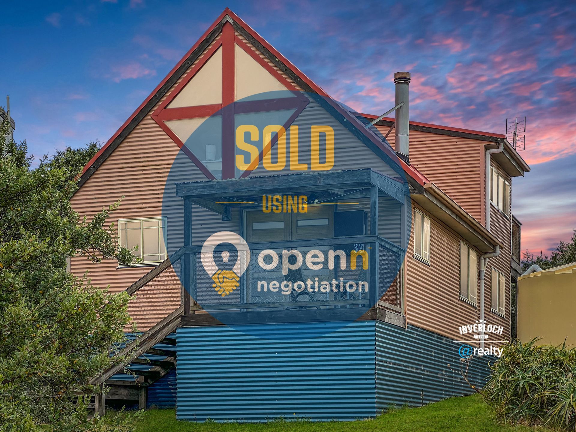 A house with a sold sign on the side of it.