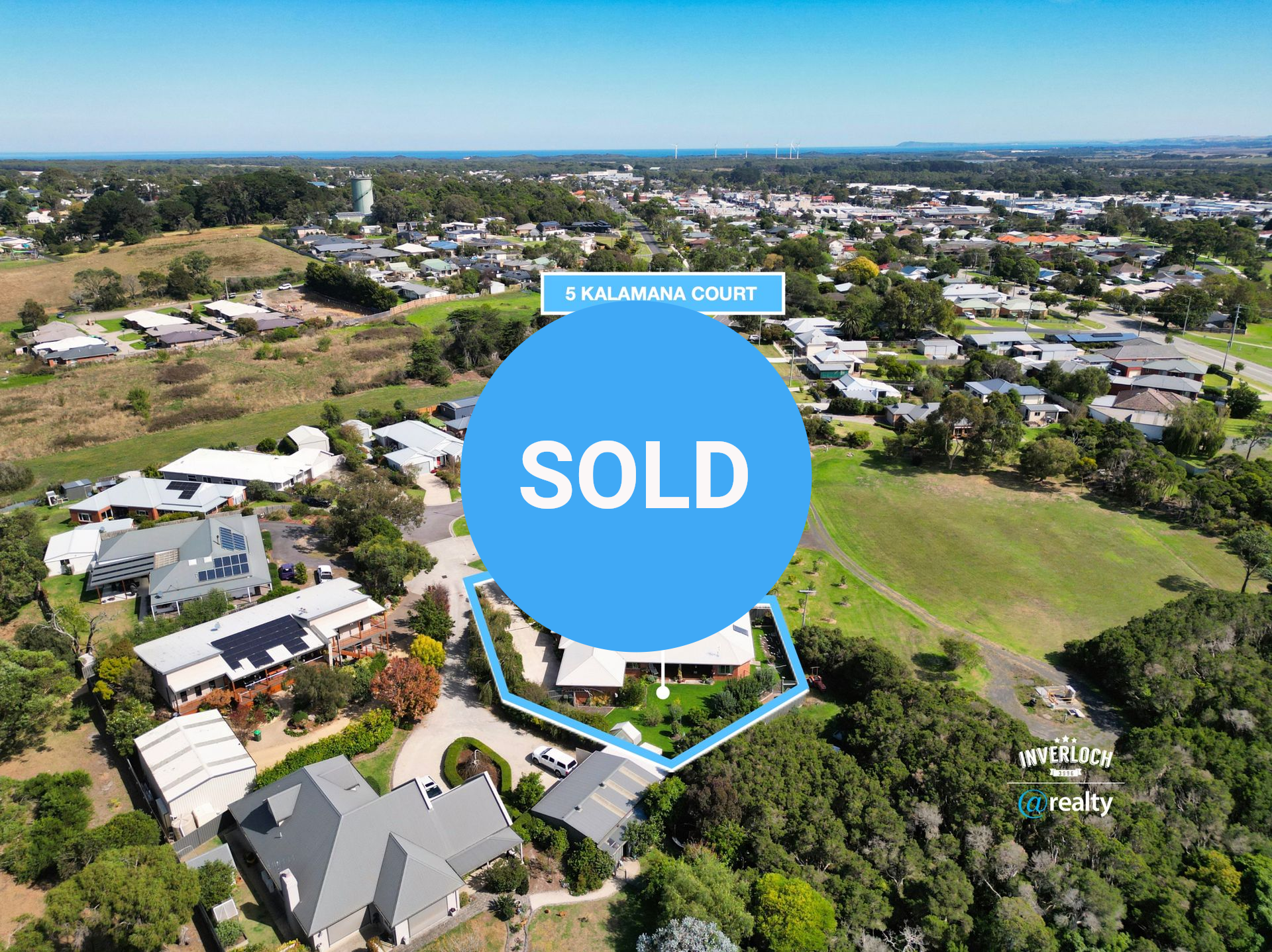 Aerial view of a residential house at 9 Kalamana Court, highlighted with a blue outline against a suburban landscape.