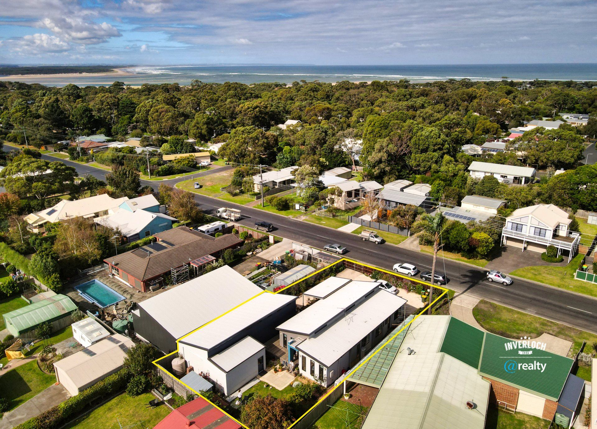 An aerial view of a residential area near the ocean