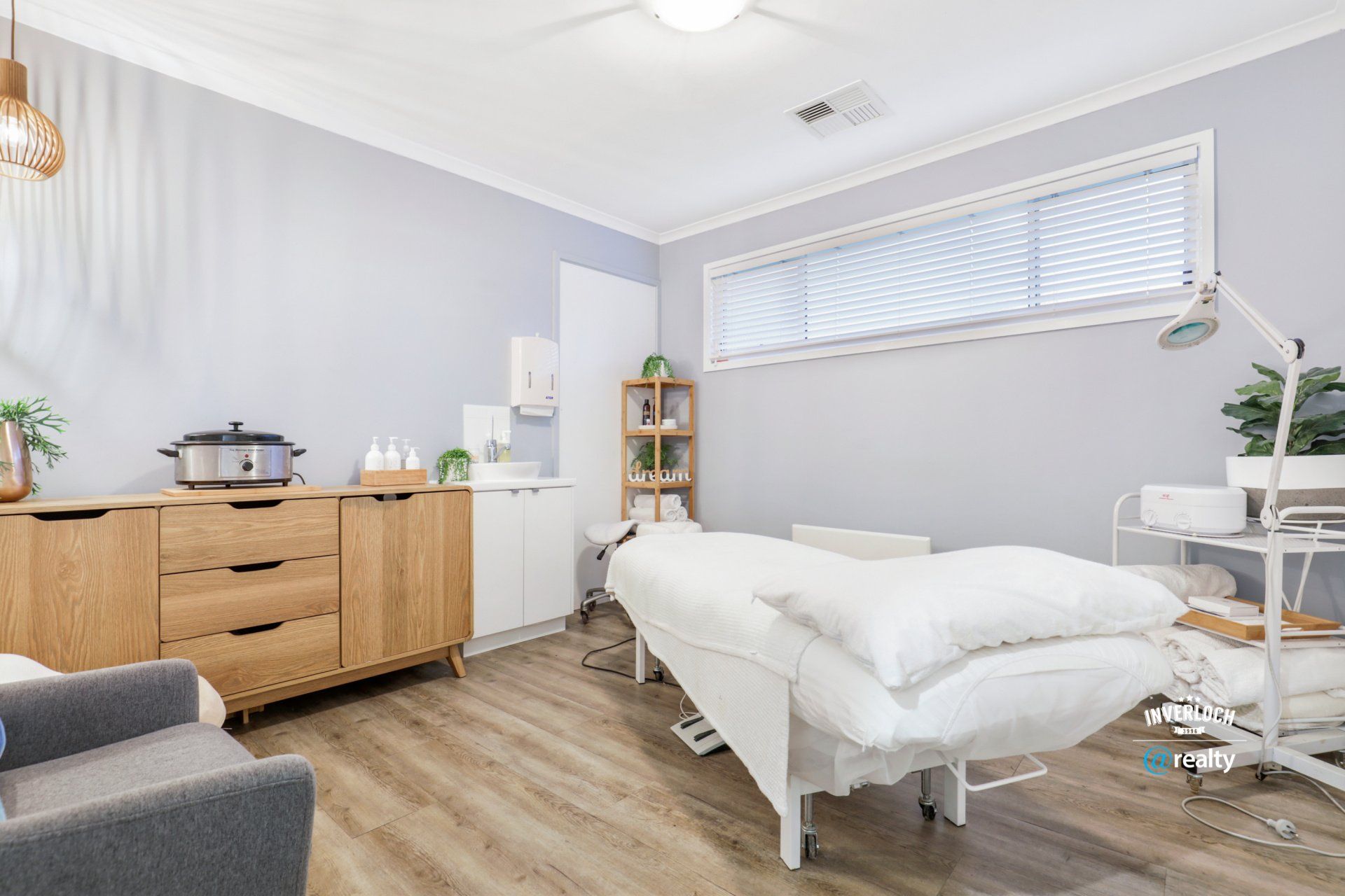 There is a massage bed in the middle of the room.