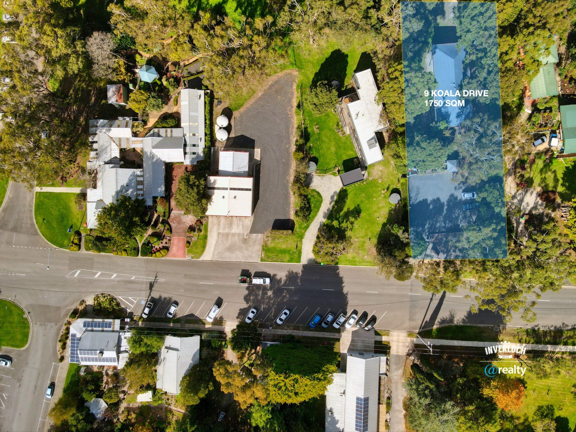 An aerial view of a residential area with houses and trees
