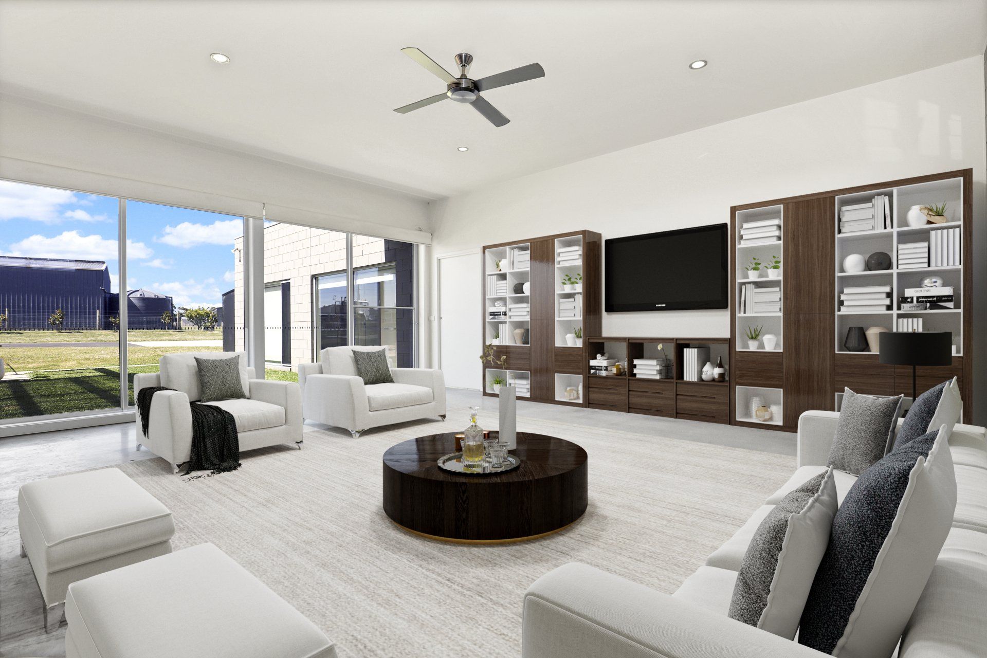 A living room with white furniture and a flat screen tv