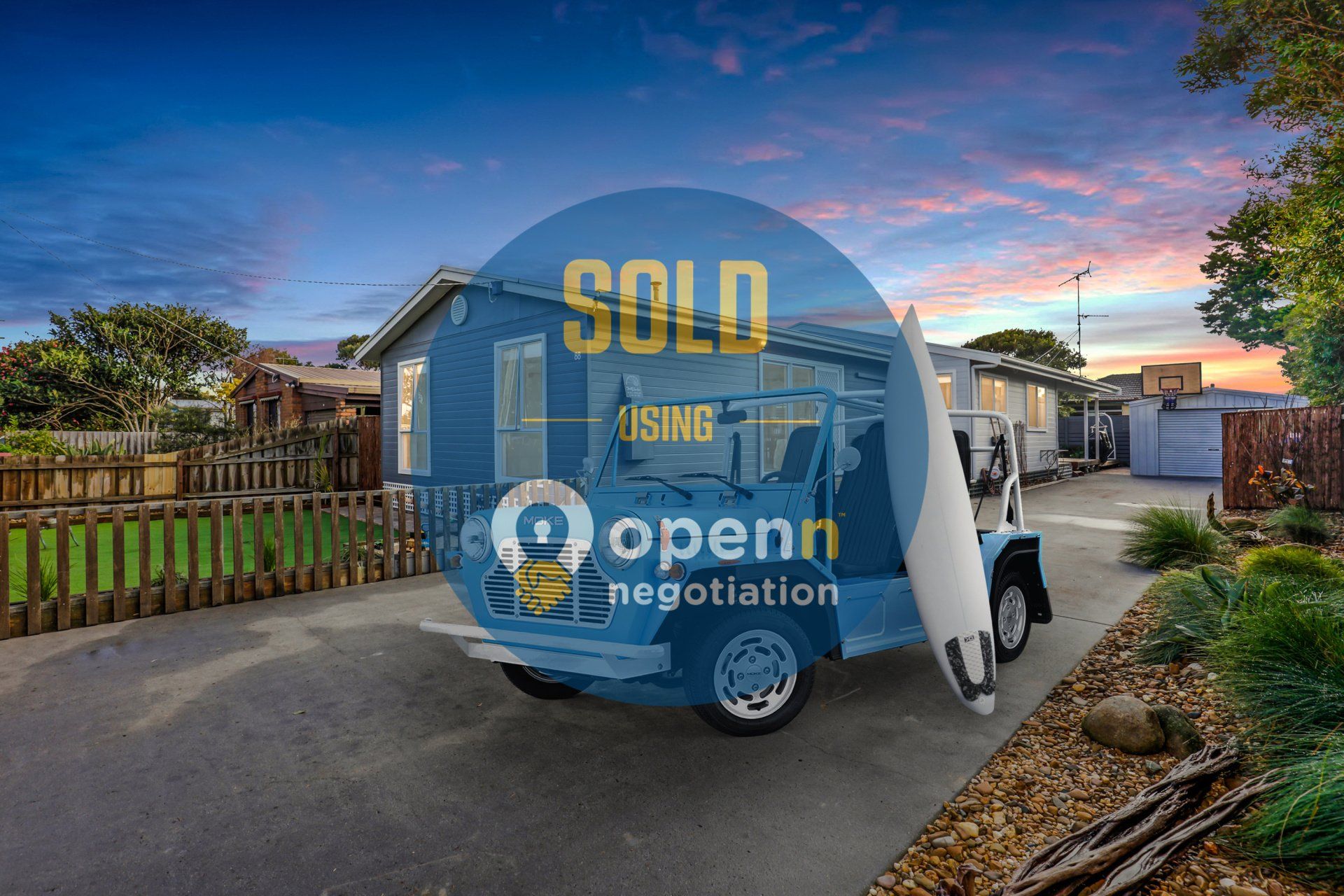 A truck is parked in front of a house that has been sold.